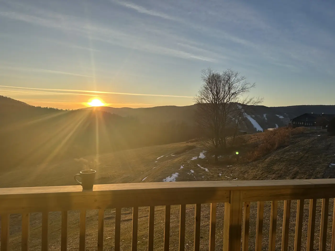 Low sun over the ridge from the cabin deck