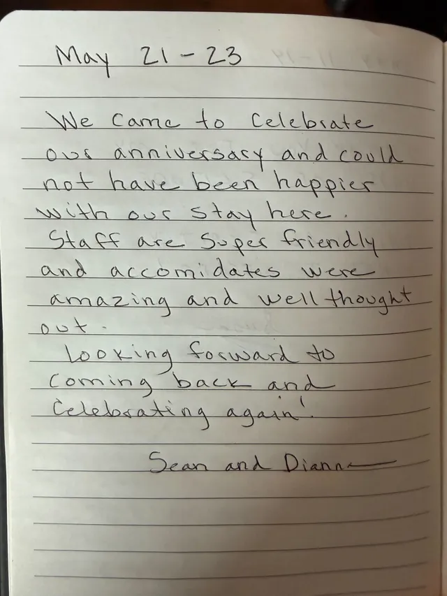 Handwritten guest journal page: May 21 - 23 We came to celebrate our anniversary and could not have been happier with our stay here.