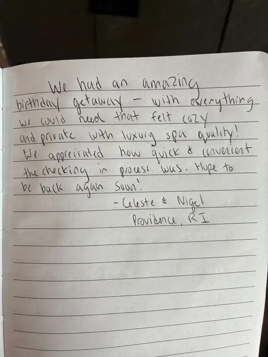 Handwritten guest journal page: We had an amazing birthday getaway - with everything we could need that felt cozy and private with l