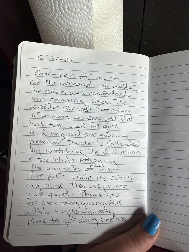 Handwritten guest journal page: 5-31-26 Cool + rain for much of the weekend - no matter, the cabin was comfortable and relaxing. Whe