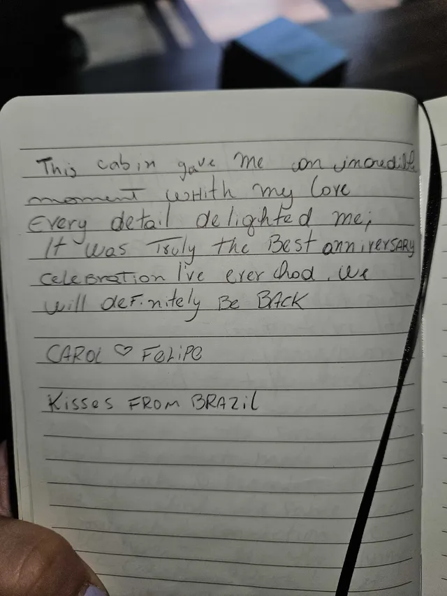Handwritten guest journal page: This cabin gave me an incredible moment with my love Every detail delighted me; It was Truly the Bes