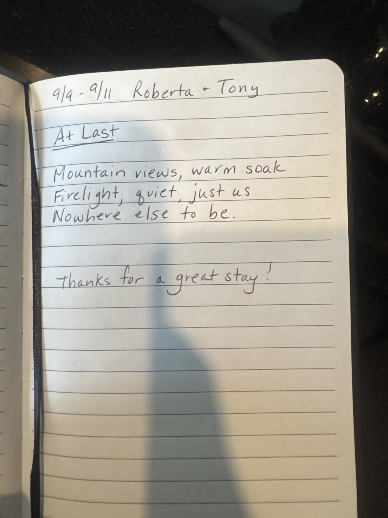 Handwritten guest journal page: 9/9 - 9/11 Roberta + Tony At Last Mountain views, warm soak Firelight, quiet, just us Nowhere else t