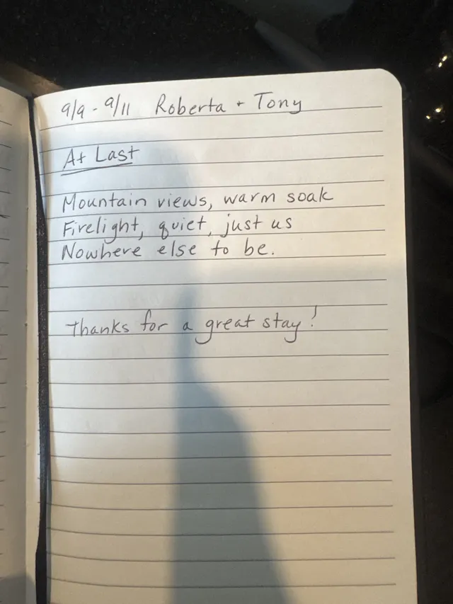 Handwritten guest journal page: 9/9 - 9/11 Roberta + Tony At Last Mountain views, warm soak Firelight, quiet, just us Nowhere else t