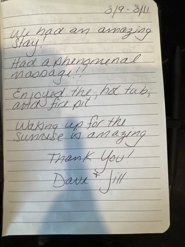 Handwritten guest journal page: 8/9 - 8/11 We had an amazing Stay. Had a phenomenal massage!! Enjoyed the hot tub, and fire pit! Wak