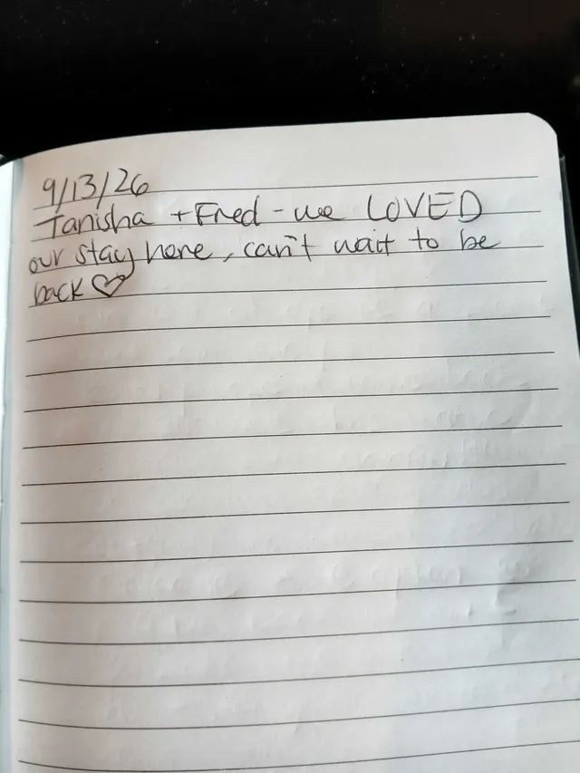 Handwritten guest journal page: 9/13/26 Tanisha + Fred - we LOVED our stay here, can't wait to be back♡