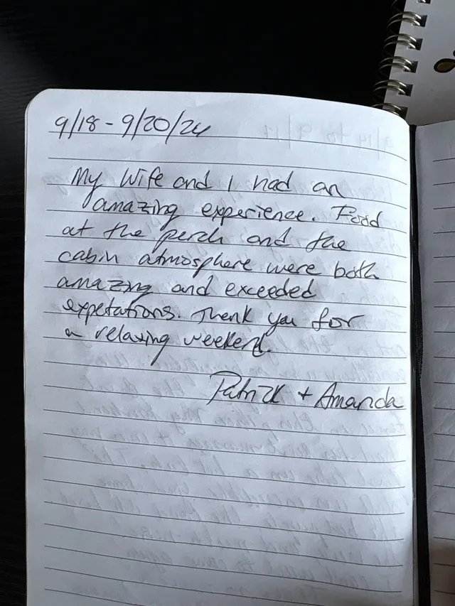 Handwritten guest journal page: 9/18 - 9/20/26 My Wife and I had an amazing experience. Food at the perch and the cabin atmosphere w