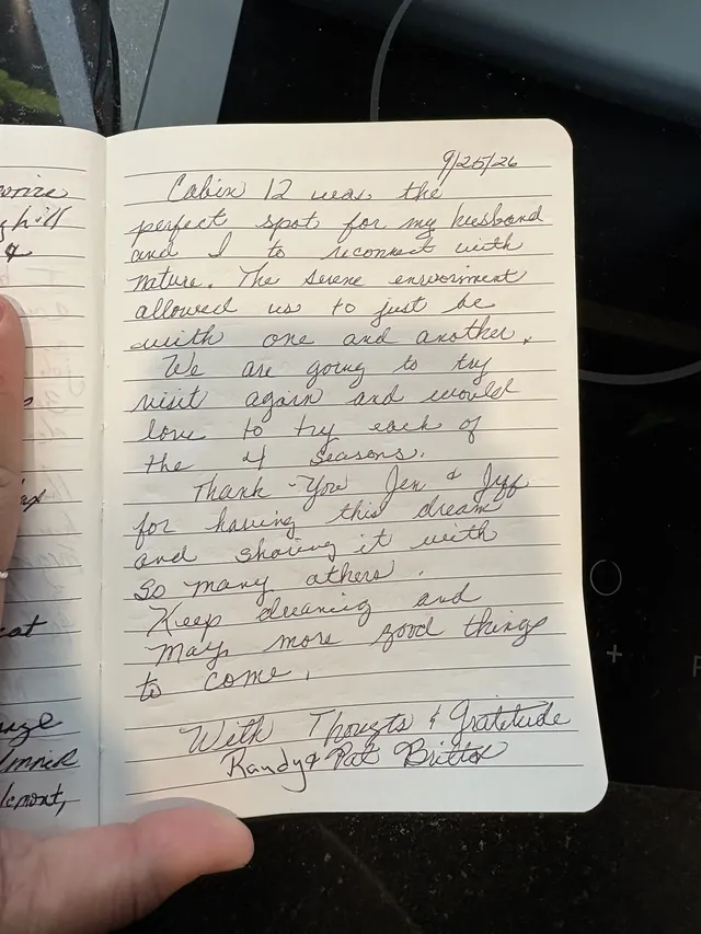 Handwritten guest journal page: 9/25/26 Cabin 12 was the perfect spot for my husband and I to reconnect with nature. The serene envi