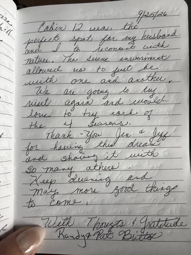 Handwritten guest journal page: 9/25/26 Cabin 12 was the perfect spot for my husband and I to reconnect with nature. The serene envi