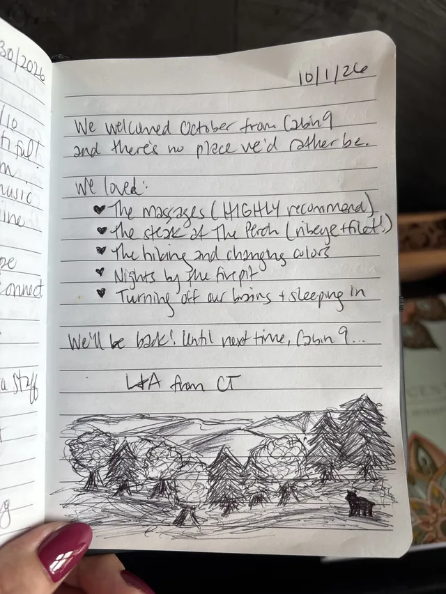 Handwritten guest journal page: 10/1/26 We welcomed October from Cabin 9 and there's no place we'd rather be. We loved: ♡ The massag