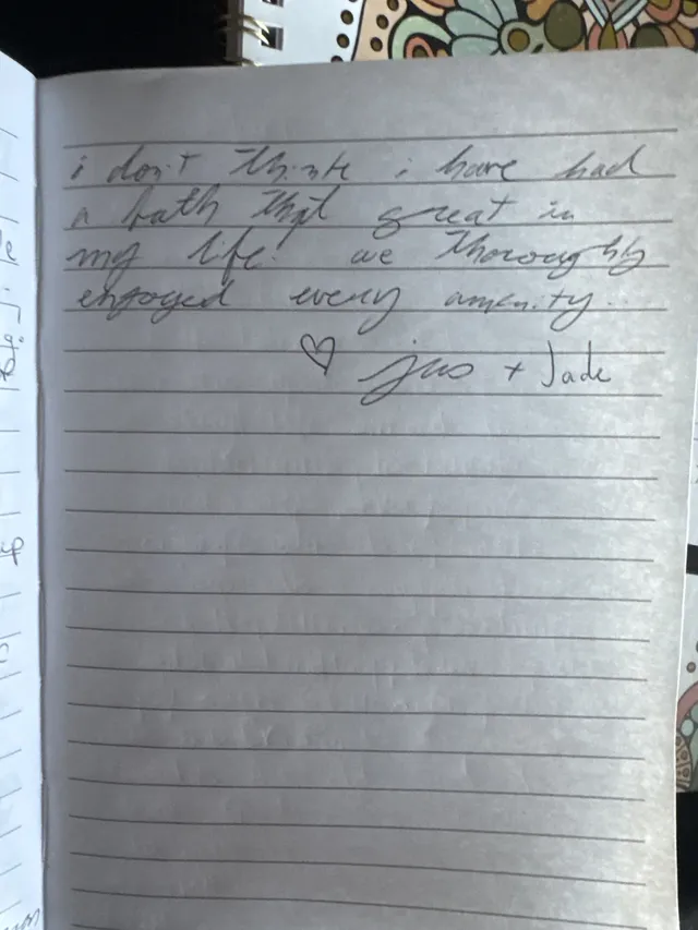 Handwritten guest journal page: i don't think i have had a bath that great in my life! we thoroughly enjoyed every amenity.. ♡ Josh 