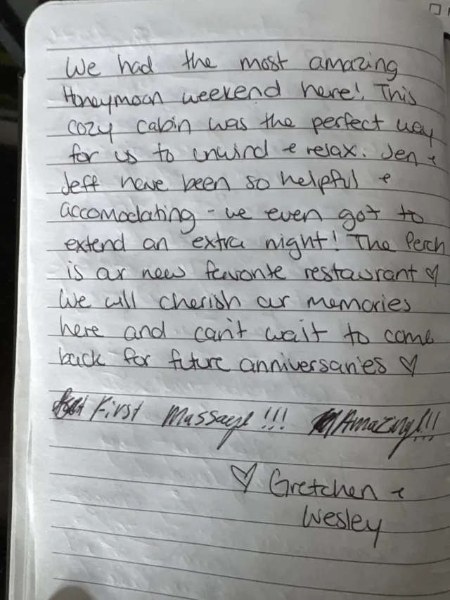 Handwritten guest journal page: We had the most amazing honeymoon weekend here! This cozy cabin was the perfect way for us to unwind