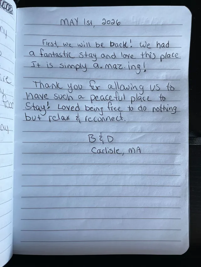 Handwritten guest journal page: MAY 1st, 2026 First, we will be back! We had a fantastic stay and love this place. It is simply a.ma