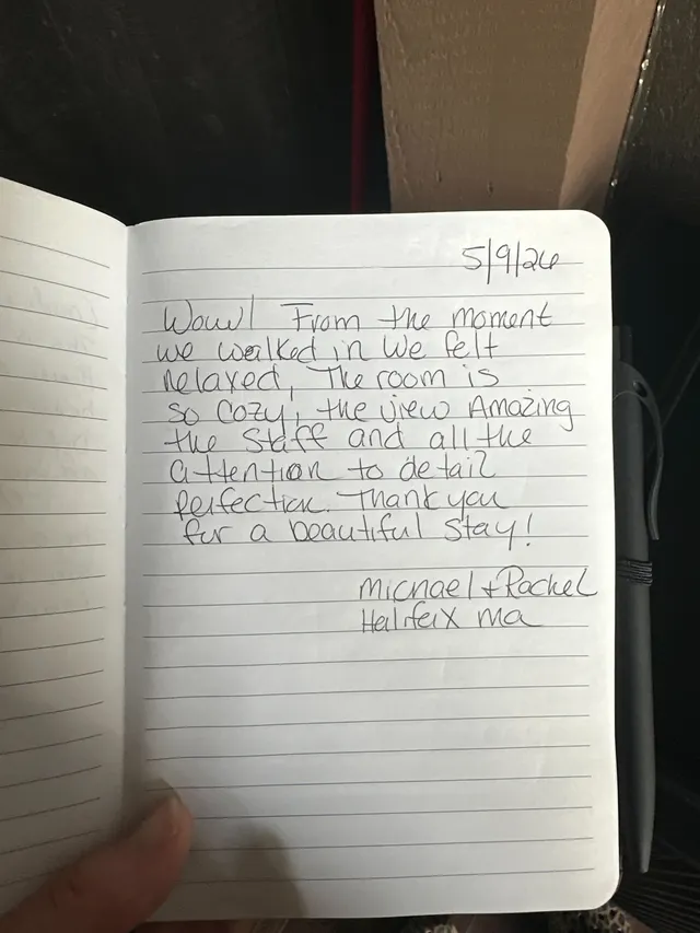 Handwritten guest journal page: 5/9/26 Wow! From the moment we walked in we felt relaxed, The room is so cozy, the view Amazing the 