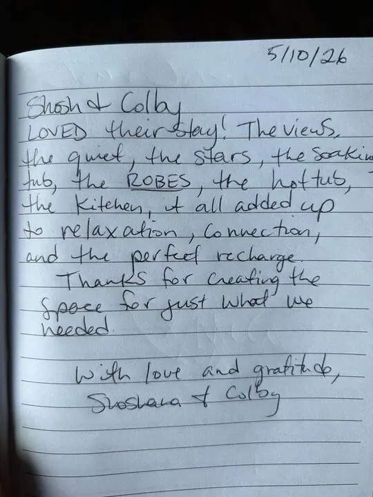 Handwritten guest journal page: 5/10/26 Shosh & Colby LOVED their stay! The views, the quiet, the stars, the soaking tub, the ROBES,